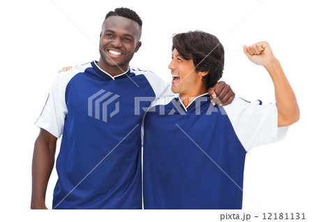 Football players in blue celebrating 12181131