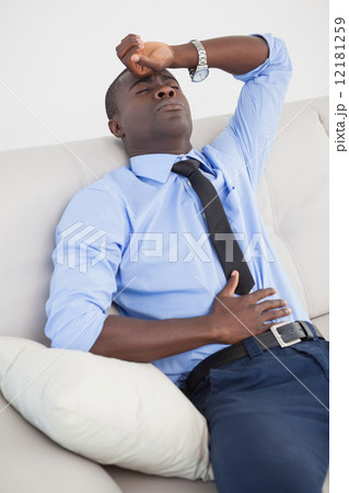 Tired businessman getting a headache Tired businessman getting a headache 12181259