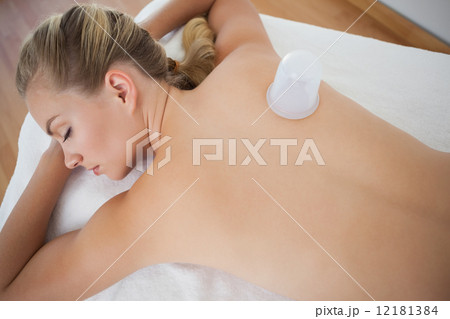 Pretty blonde with vacuum cup on her back Pretty blonde with vacuum cup on her back 12181384