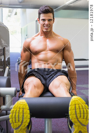 Muscular man doing a leg workout at gym Muscular man doing a leg workout at gym 12181978
