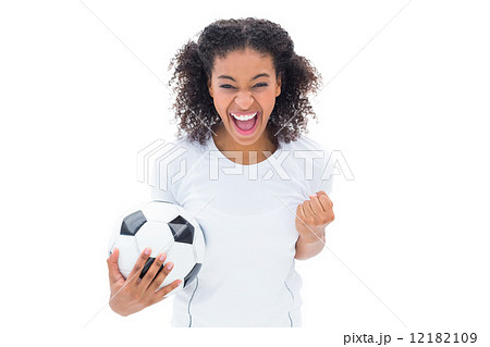 Pretty football fan in white cheering at camera Pretty football fan in white cheering at camera 12182109