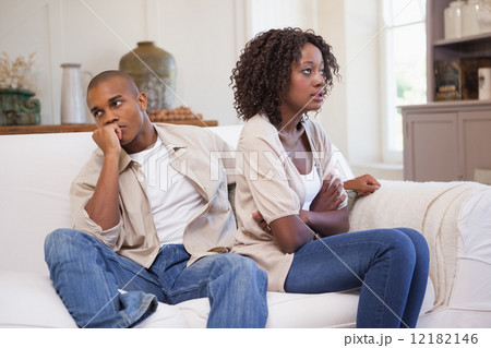 Unhappy couple arguing on the couch 12182146