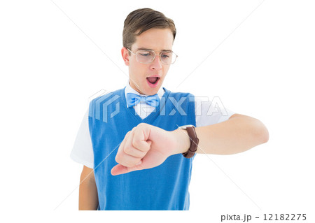 Geeky young hipster looking at the time Geeky young hipster looking at the time 12182275