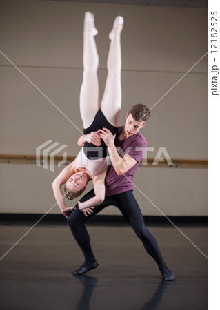 Ballet partners dancing gracefully together Ballet partners dancing gracefully together 12182525