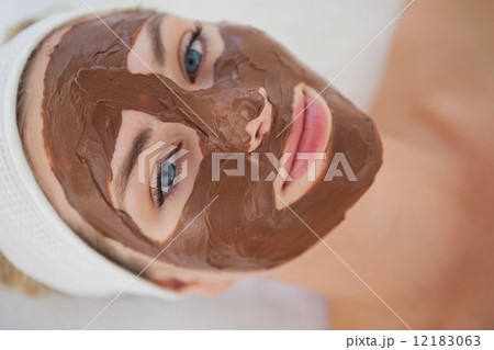 Beautiful blonde getting a chocolate facial treatment Beautiful blonde getting a chocolate facial treatment 12183063