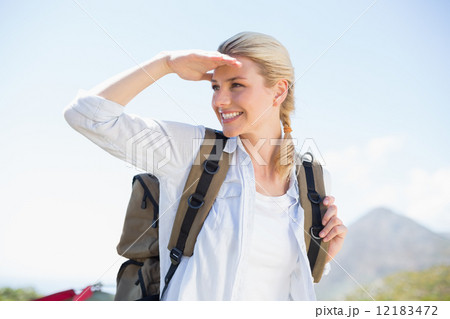 Attractive hiking blonde looking around Attractive hiking blonde looking around 12183472