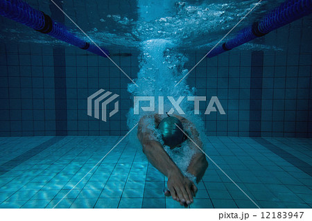 Fit swimmer training on his own 12183947