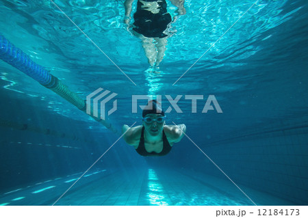 Athletic swimmer training on her own 12184173