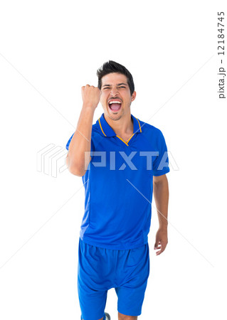 Happy football player in blue celebrating 12184745