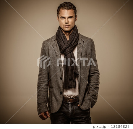 Handsome young man in casual jacket and neck scarf Handsome young man in casual jacket and neck scarf 12184822