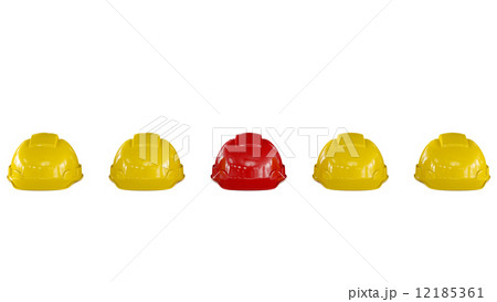 Line of yellow safety helmets with a red one 12185361