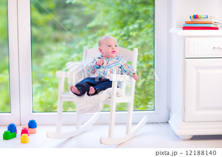 Baby boy in a rocking chair 12188140