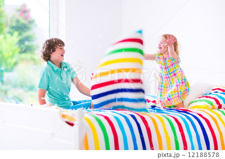 Kids having pillow fight 12188578