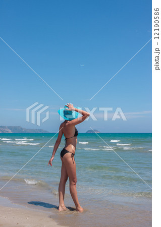 woman in hat on the beach woman in hat on the beach 12190586