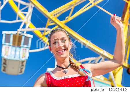 Woman visiting Bavarian fair in national costume 12195419