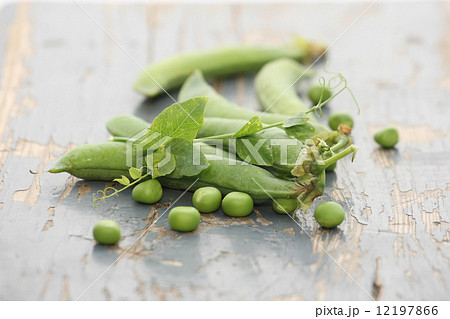 fresh pea pods on a background of colored  boards 12197866