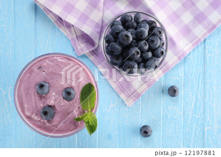 yogurt with blueberries in a glass bowl and blueberries in a gla yogurt with blueberries in a glass bowl and blueberries in a gla 12197881