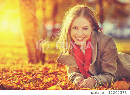 happy young beautiful woman in the autumn 12202378