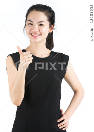 Young asian woman giving thumbs up Young asian woman giving thumbs up 12205652