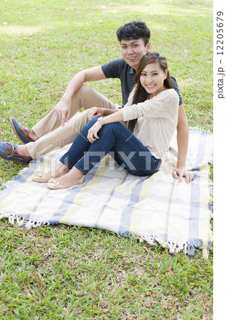 Young couple in a park. Young couple in a park. 12205679