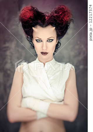 Portrait of beautiful horned woman with bright makeup Portrait of beautiful horned woman with bright makeup 12217374