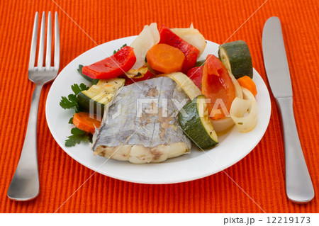 boiled swordfish with vegetables on the plate 12219173
