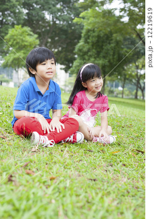 Two kids playing in the park. Two kids playing in the park. 12219619