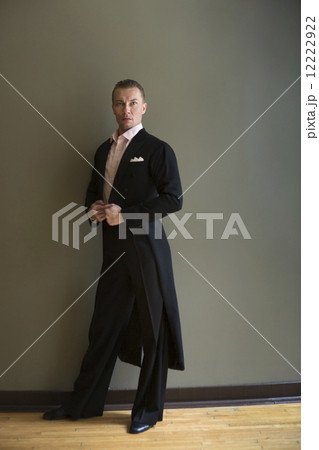 Dancer in dance studio. A man in a frock coat. Dancer in dance studio. A man in a frock coat. 12222922