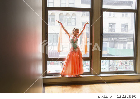 Dancer in dance studio. A woman posing at a window. Dancer in dance studio. A woman posing at a window. 12222990