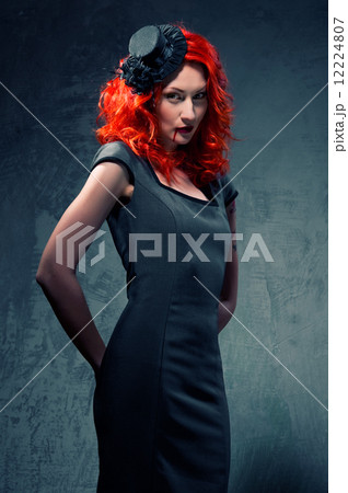 Redhead woman with blood on her lips Redhead woman with blood on her lips 12224807