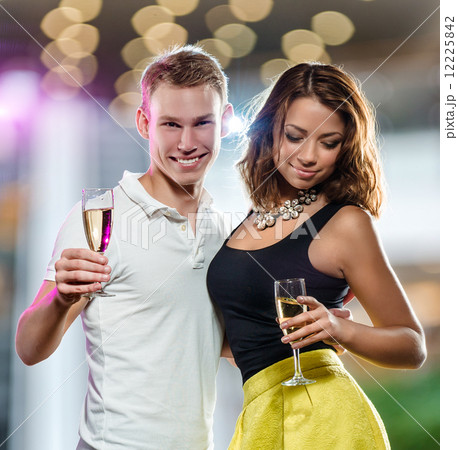 Young attractive couple with glasses of sparkling champagne Young attractive couple with glasses of sparkling champagne 12225842