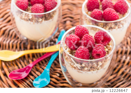 Yogurt with muesli and fresh raspberries 12226647