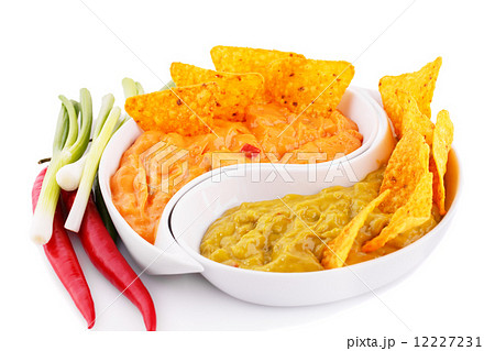 Nachos, guacamole and cheese sauce, vegetables Nachos, guacamole and cheese sauce, vegetables 12227231