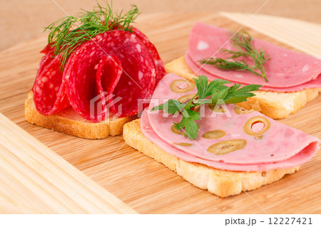 Sandwiches with salami and mortadella Sandwiches with salami and mortadella 12227421