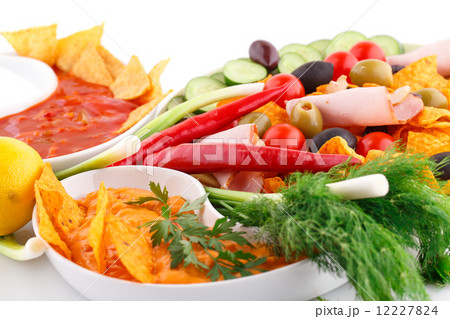 Nachos, olives, pork loin, sauce and vegetables 12227824