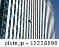 Gondola with window cleaners on skyscraper 12228898