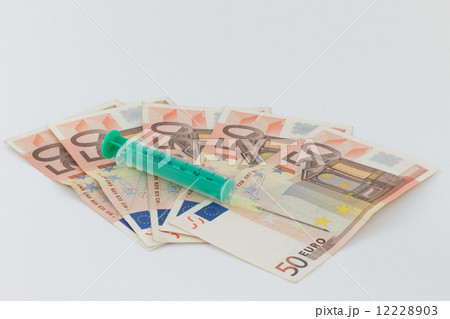 Drug trafficking, syringe, Euro bills Drug trafficking, syringe, Euro bills 12228903