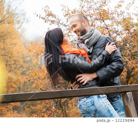 Happy middle-aged couple outdoors on beautiful autumn day 12229894