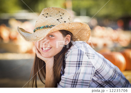 Pretty Preteen Girl Portrait at the Pumpkin Patch Pretty Preteen Girl Portrait at the Pumpkin Patch 12235706
