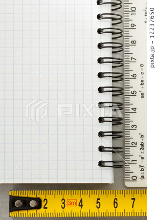 checked note paper at metal background 12237650