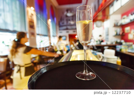glass of champagne in cafe 12237710