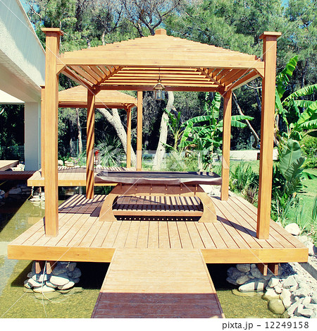 wood pavilion for massage in tropical garden on summer resort wood pavilion for massage in tropical garden on summer resort 12249158