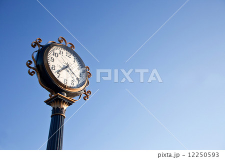 clock post with blue sky 12250593