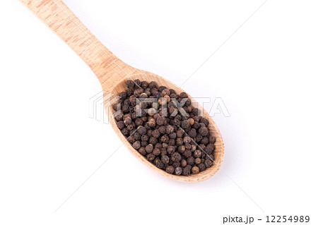 Black peppercorns on a wooden spoon. Black peppercorns on a wooden spoon. 12254989