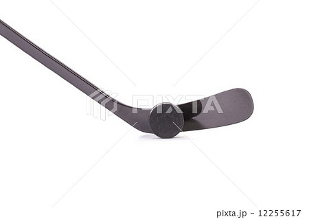 Black ice hockey stick and puck. 12255617