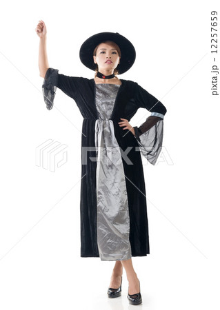 Asian witch hold something 12257659
