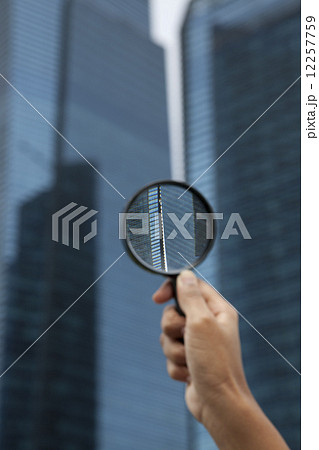 Handing holding magnifying glass 12257759