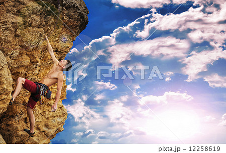 Climber and sunset 12258619