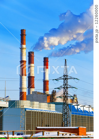 Thermal power station pipes smoke over a city... Thermal power station pipes smoke over a city... 12260000