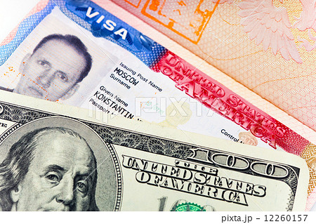 The American visa on page of the Russian international passport and US dollars 12260157